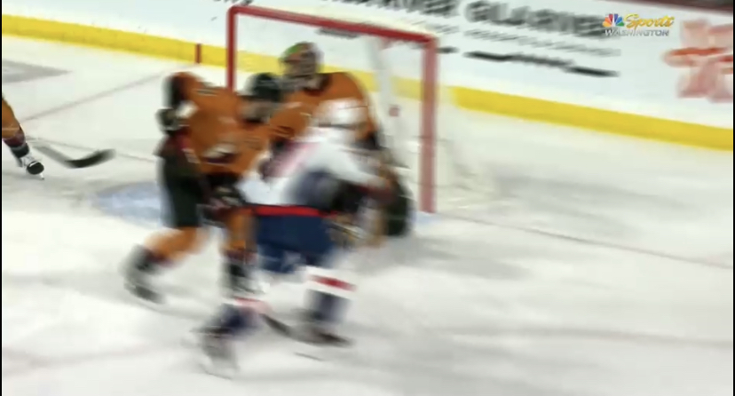 Washington's Dylan Strome deflects a shot past Arizona Coyotes goalie Karel Vejmelka